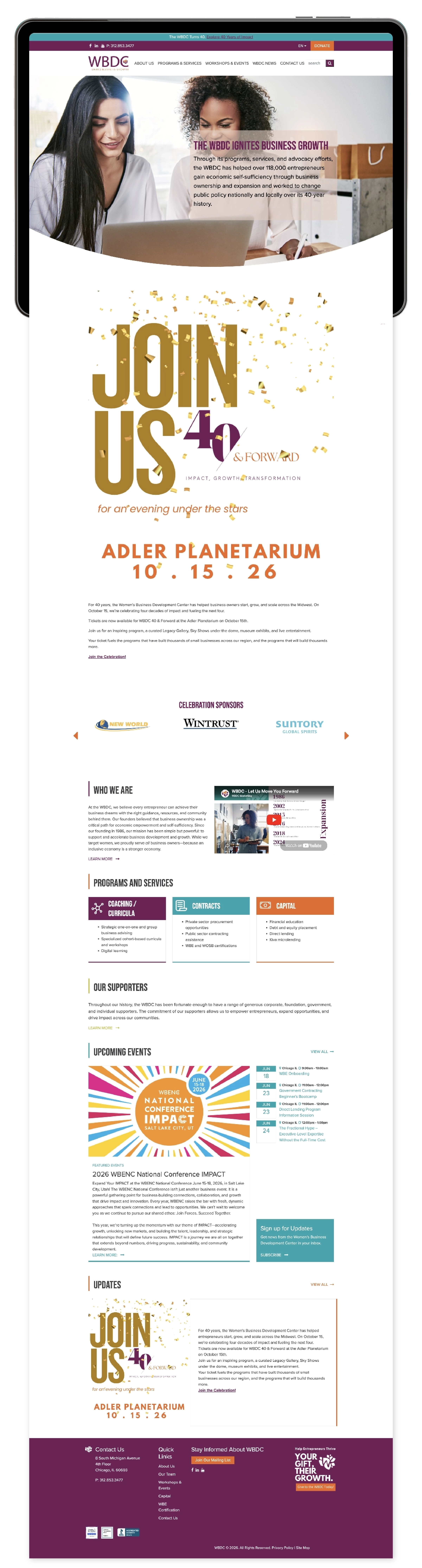 The homepage of WBDC extends beyond a tablet to show off its modern and sleek design